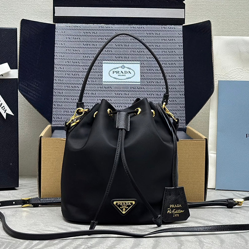 PRADA BUCKET BAG 19 IN BLACK RE-NYLON AND CALFSKIN HANDLE
